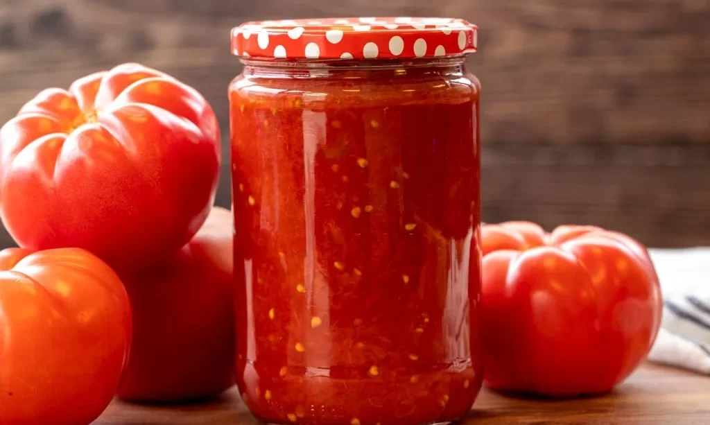 Canned tomato sauce in glass jar