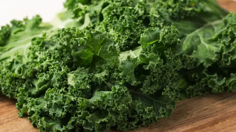 Curly Kale on a wooden cutting board