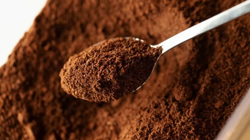 Ground coffee in spoon