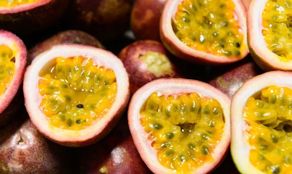 Group of passion fruits and its cross section with seeds