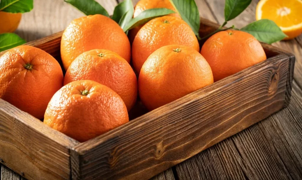 Orange fruit in wooden box