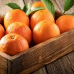 Orange fruit in wooden box
