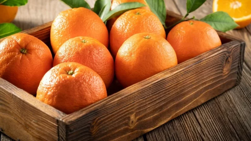 Orange fruit in wooden box